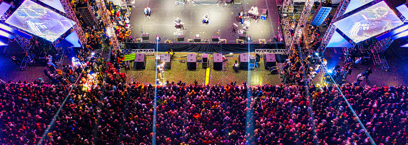 large concert crowd with stage lights